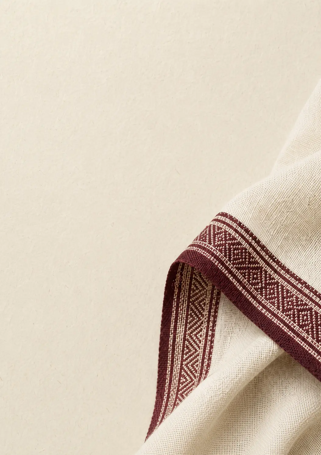 Cream handloom saree with a maroon woven border