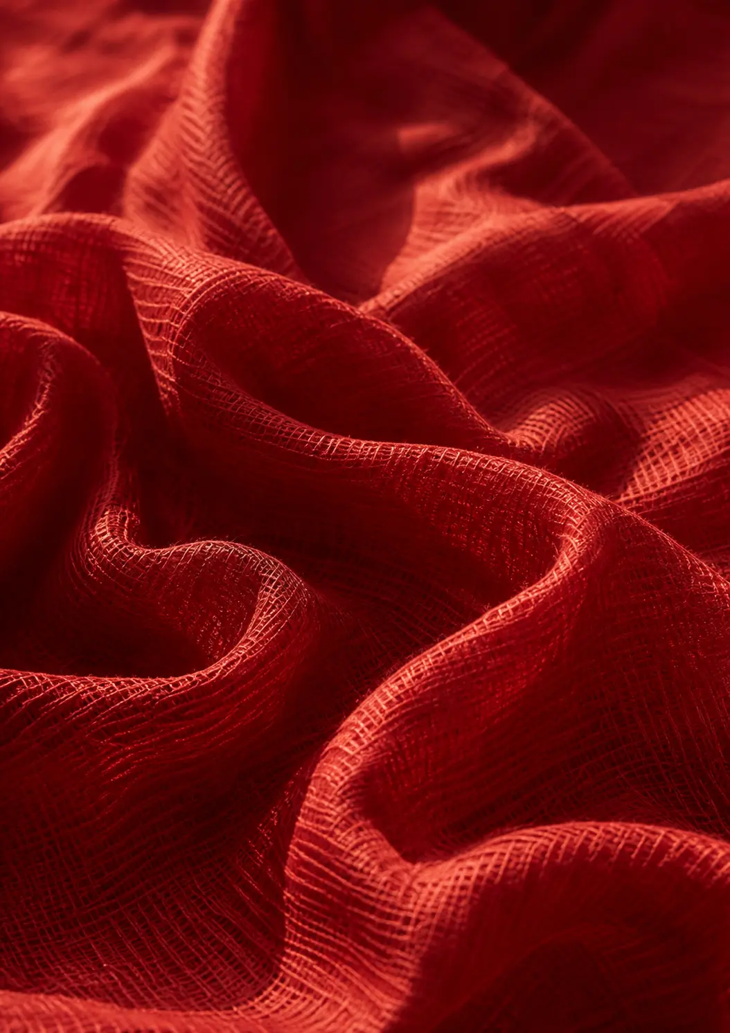 Luminous red Kota cloth arranged in soft folds