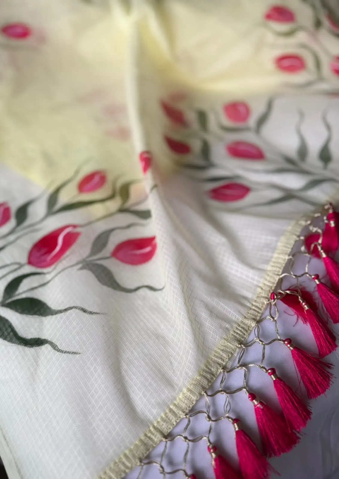 Close detail of the painted tulips and pink tassels